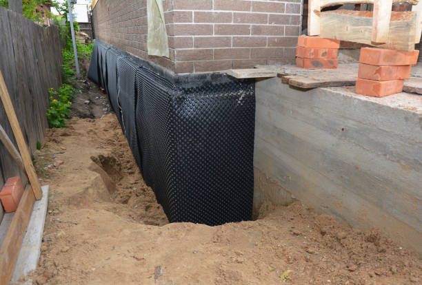 SJ Waterproofing Pros technician performing targeted Basement Waterproofing assessment in Cresskill, NJ